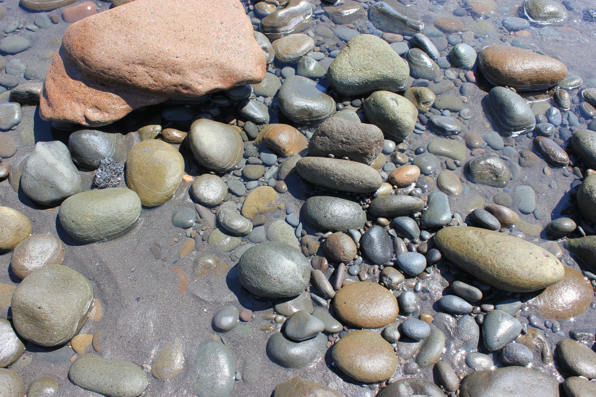 Colourful river stones on a Taranaki beach